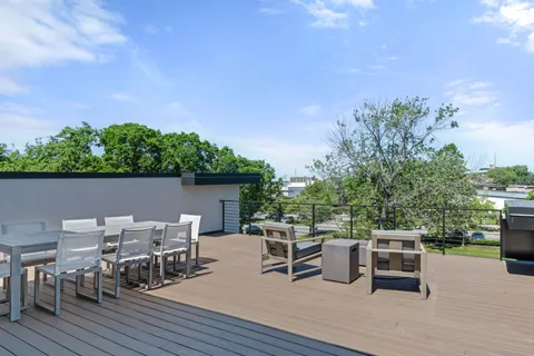 a roof deck view with a seating space