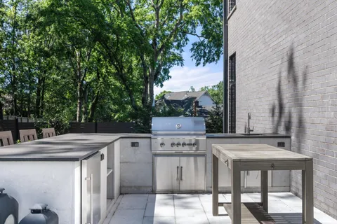 a view of a kitchen with a table and chairs