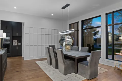 a view of a dining room with furniture and wooden floor