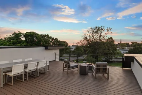a view of a lake with outdoor seating