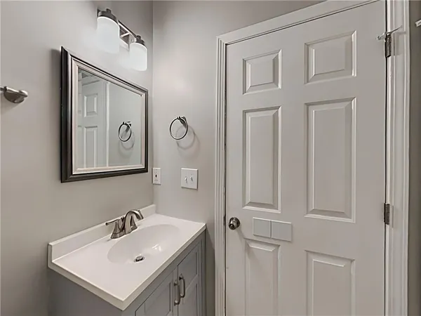 a bathroom with a sink and mirror
