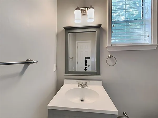 a bathroom with a sink and a mirror