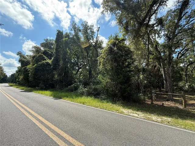 a view of swimming pool with a yard