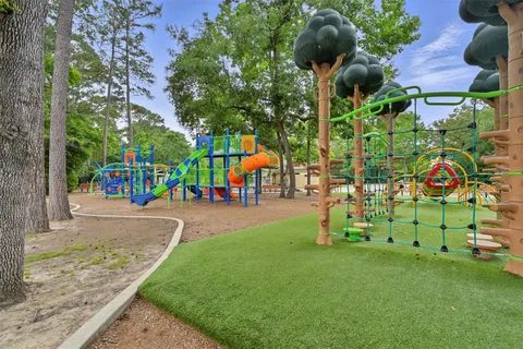 a childrens park with lots of swings and slides