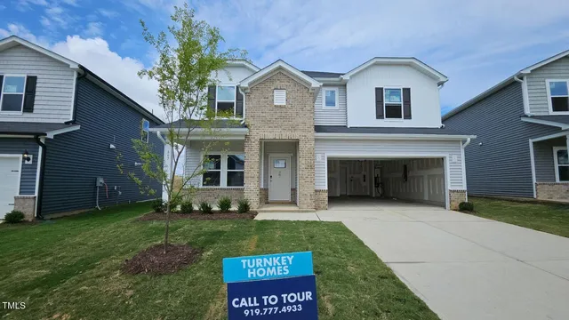 a bathroom with sink a mirror a vanity and a shower
