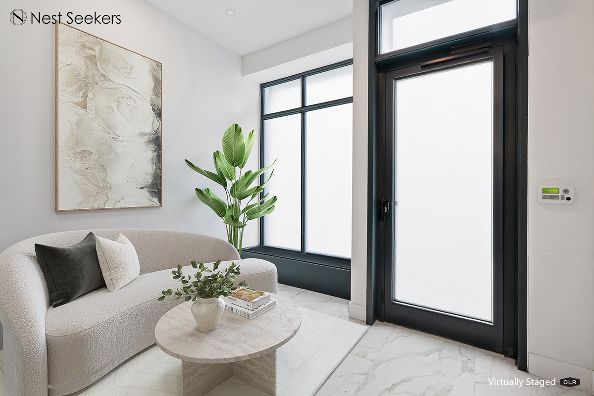 45-29 47th Street, Unit 5B Queens, NY 11377 - Photo 10 of 11 a living room with furniture and a potted plant