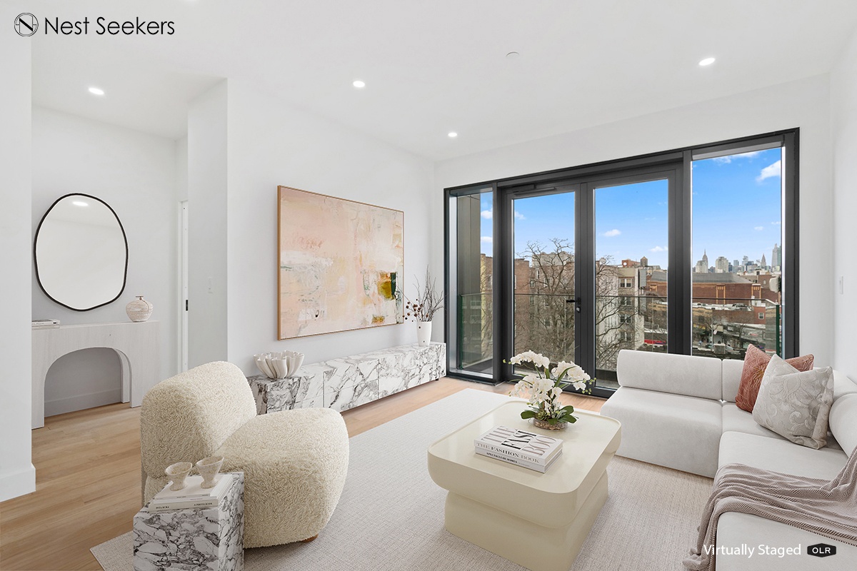 45-29 47th Street, Unit 5B Queens, NY 11377 - Photo 2 of 11 a living room with furniture and a large window