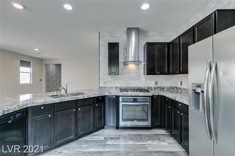 5475 Ordesa Valley Road Las Vegas, NV 89148 - Photo 23 of 35 Culinary creations come to life in this modern kitchen with sleek appliances and ample counter space.