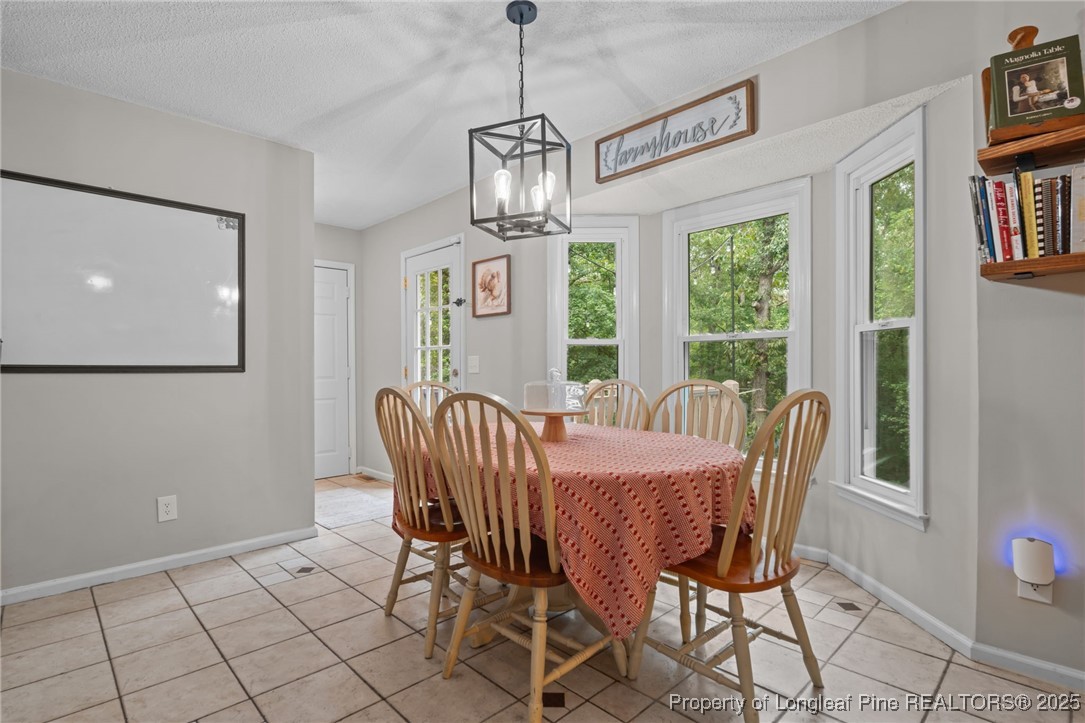76 North Hillside Drive Spring Lake, NC 28390 - Photo 14 of 50 a view of a dining room with furniture window and outside view