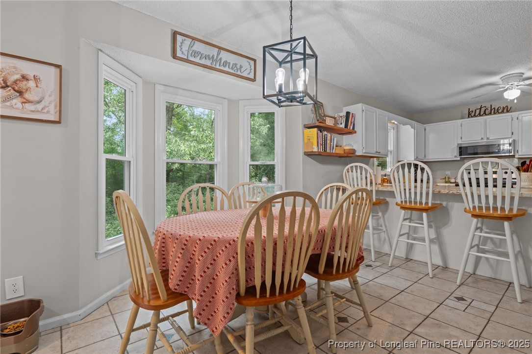 76 North Hillside Drive Spring Lake, NC 28390 - Photo 15 of 50 a view of a dining room with furniture window and outside view