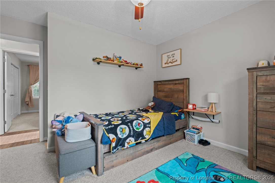 76 North Hillside Drive Spring Lake, NC 28390 - Photo 24 of 50 a bedroom with furniture and a wooden floor
