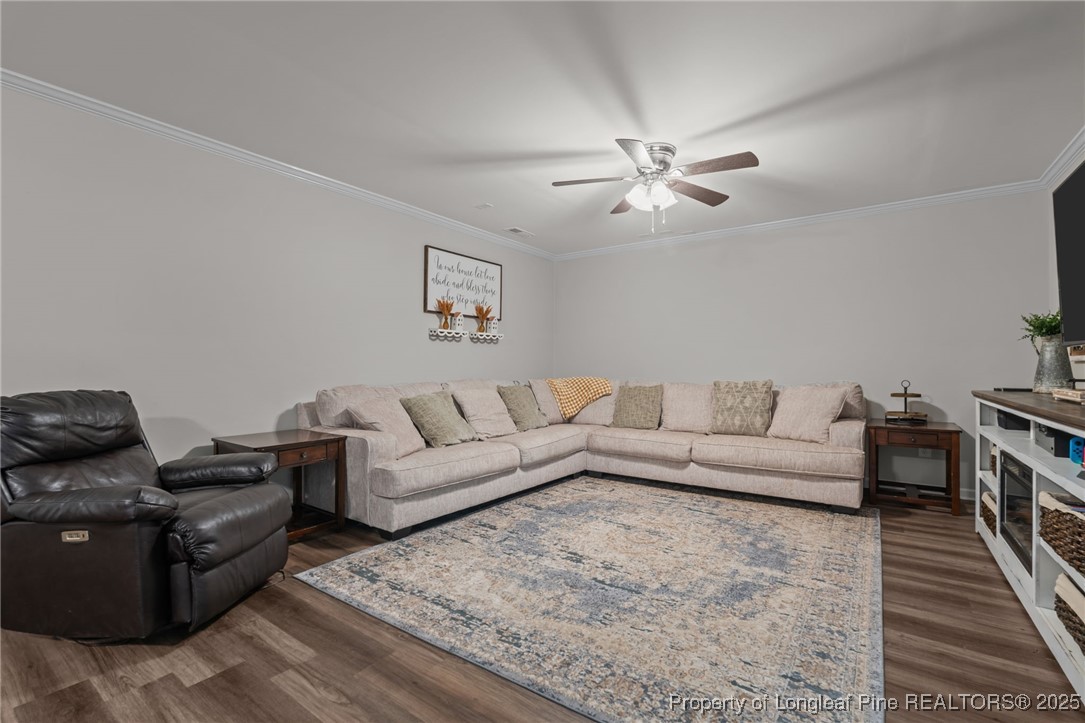 76 North Hillside Drive Spring Lake, NC 28390 - Photo 32 of 50 a living room with furniture ceiling fan and a rug