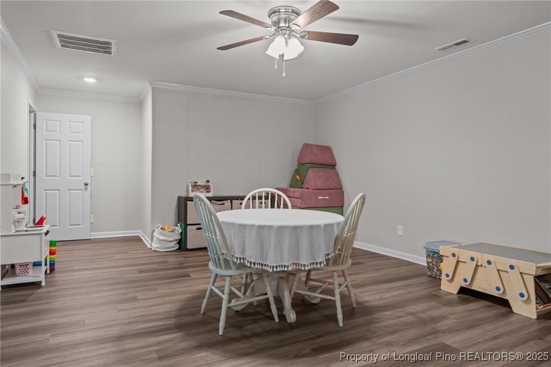 76 North Hillside Drive Spring Lake, NC 28390 - Photo 33 of 50 a view of a dining room with furniture and wooden floor