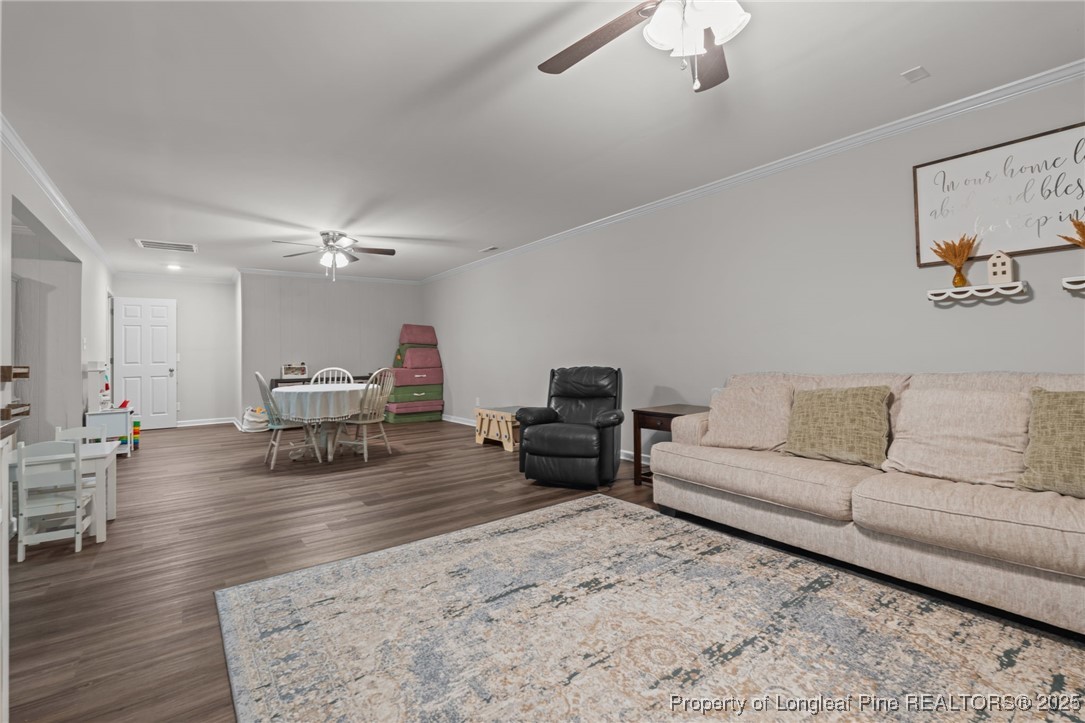 76 North Hillside Drive Spring Lake, NC 28390 - Photo 34 of 50 a living room with furniture and a wooden floor