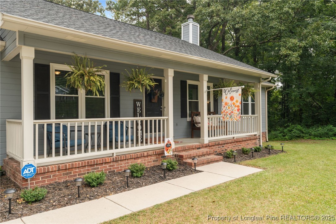 76 North Hillside Drive Spring Lake, NC 28390 - Photo 38 of 50 a front view of a house with a porch