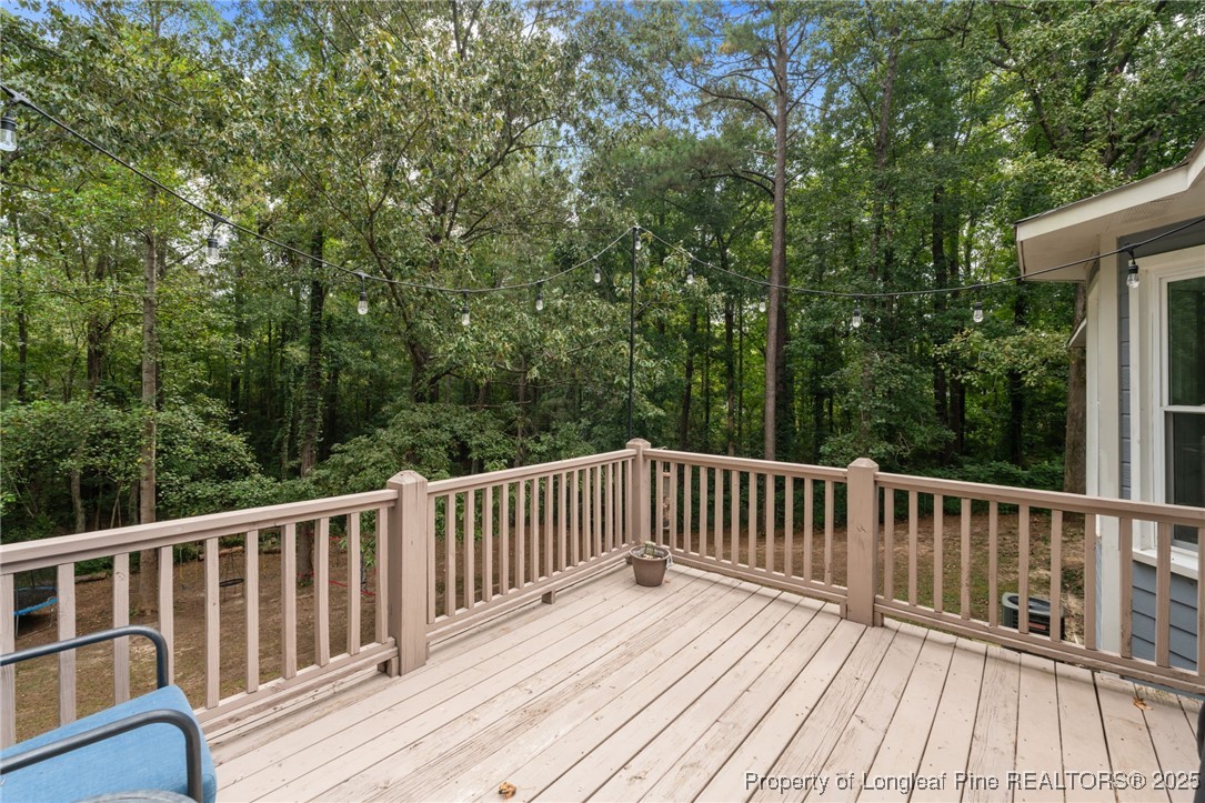 76 North Hillside Drive Spring Lake, NC 28390 - Photo 41 of 50 a view of backyard with deck and wooden floor