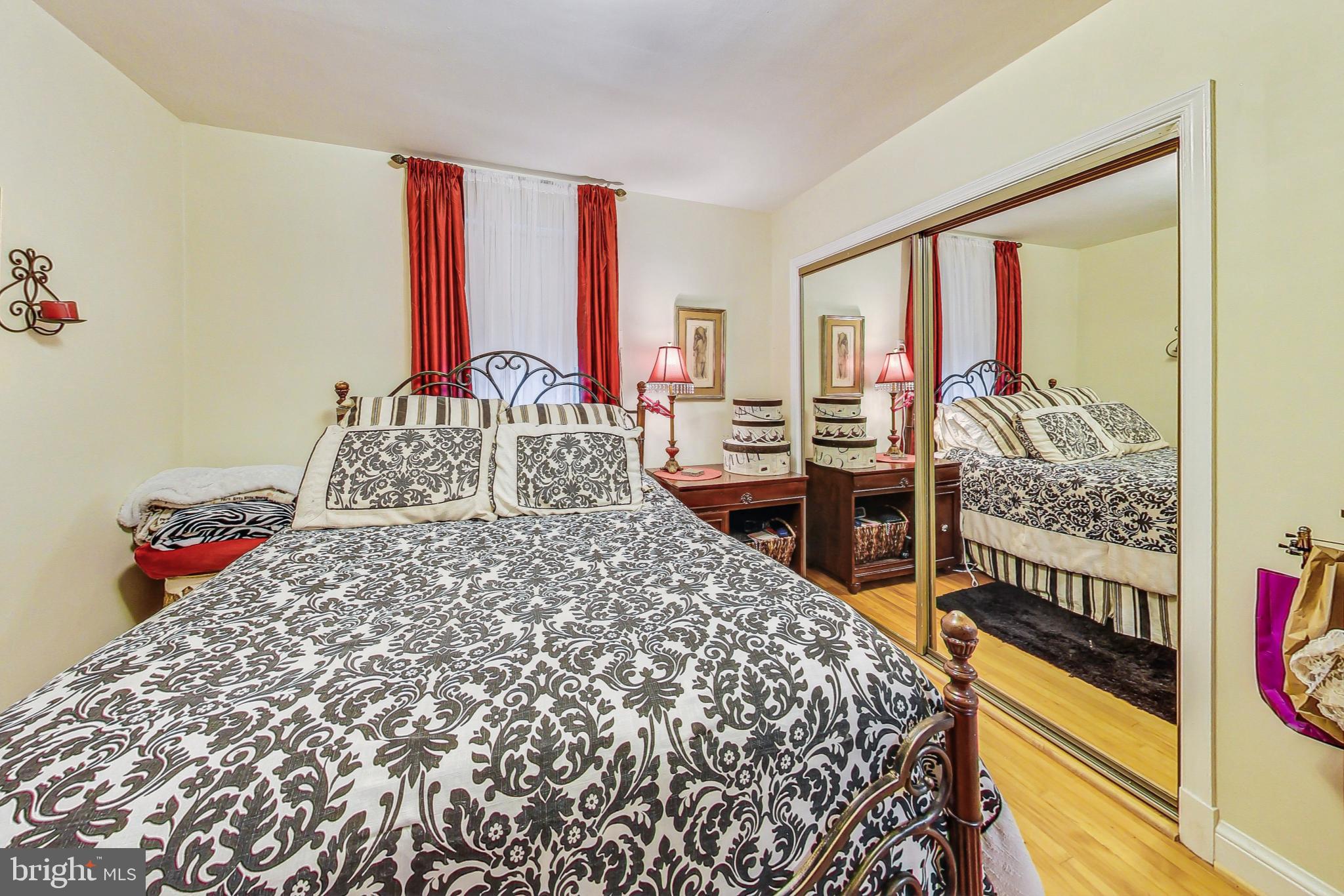 10404 Grandin Road Silver Spring, MD 20902 - Photo 14 of 38 a bed sitting in a bedroom next to a window