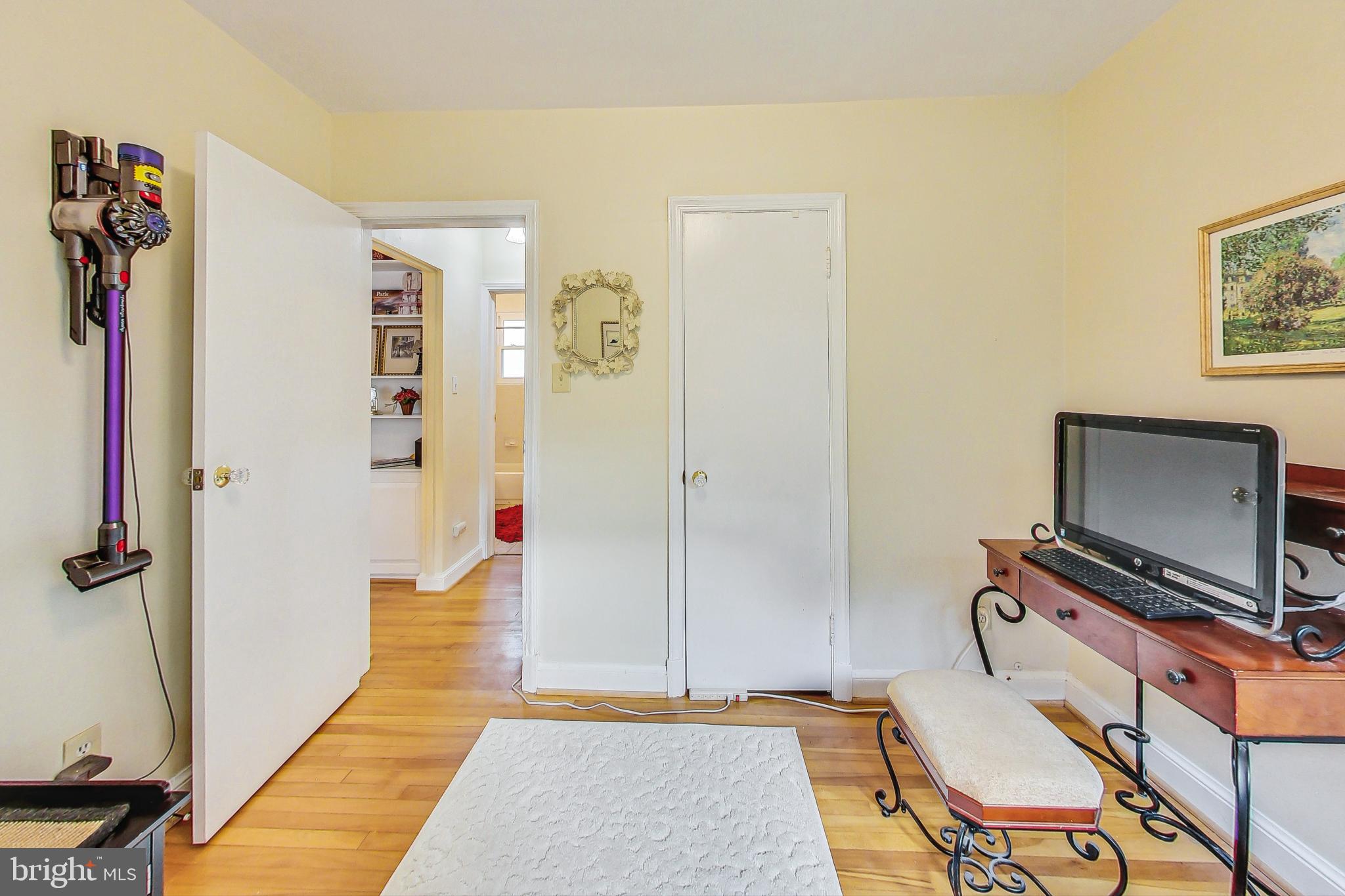 10404 Grandin Road Silver Spring, MD 20902 - Photo 17 of 38 a living room with a couch and a flat screen tv