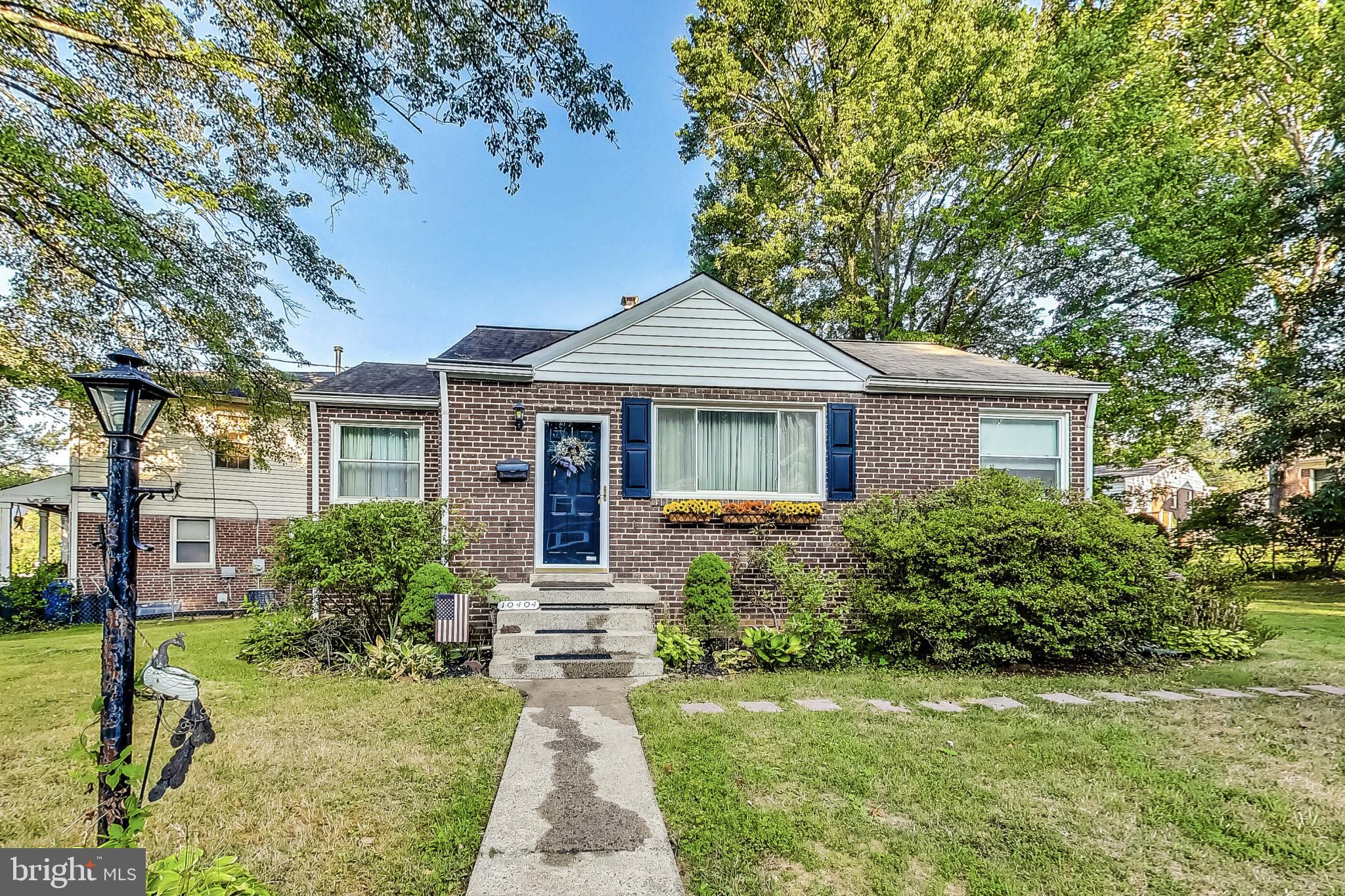 10404 Grandin Road Silver Spring, MD 20902 - Photo 2 of 38 a front view of a house with garden