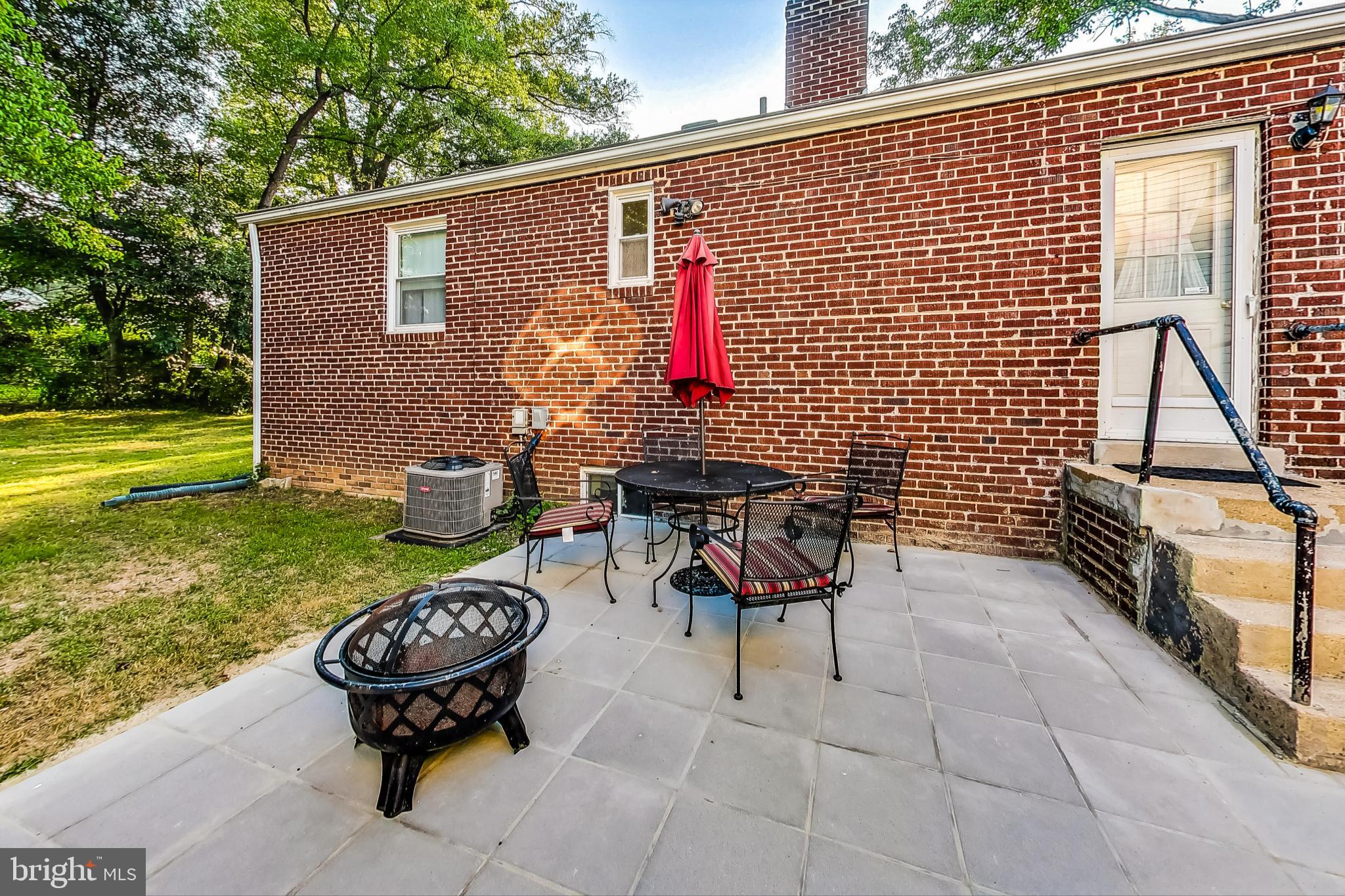 10404 Grandin Road Silver Spring, MD 20902 - Photo 30 of 38 a backyard of a house with outdoor seating