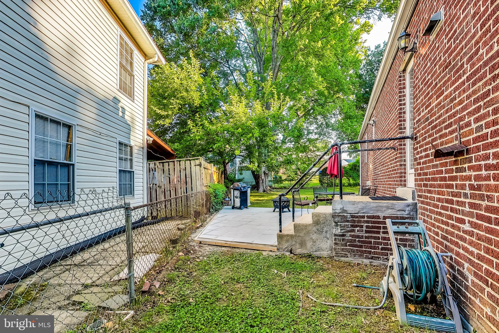 10404 Grandin Road Silver Spring, MD 20902 - Photo 36 of 38 a view of a chair and table in the backyard