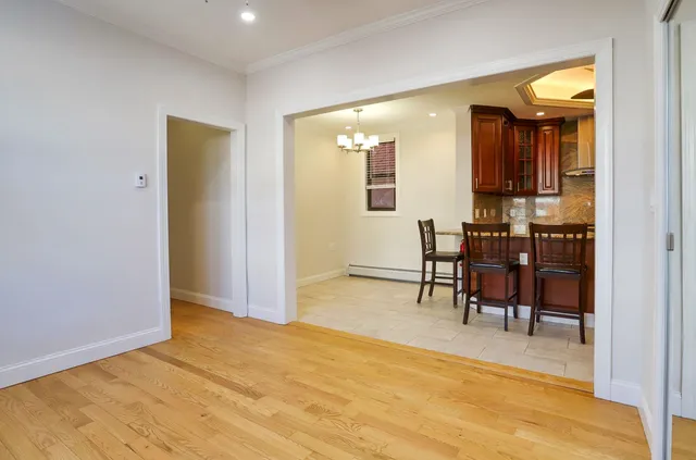 a view of dining room with furniture and wooden floor