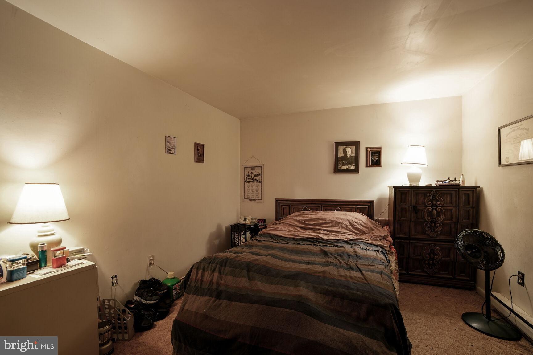 3263 Hawks Hill Road New Windsor, MD 21776 - Photo 11 of 19 a bedroom with a bed and lamp