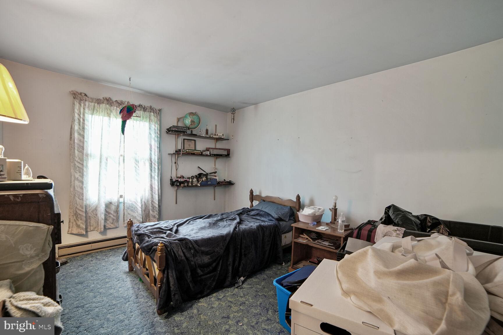 3263 Hawks Hill Road New Windsor, MD 21776 - Photo 12 of 19 a bedroom with furniture and a window