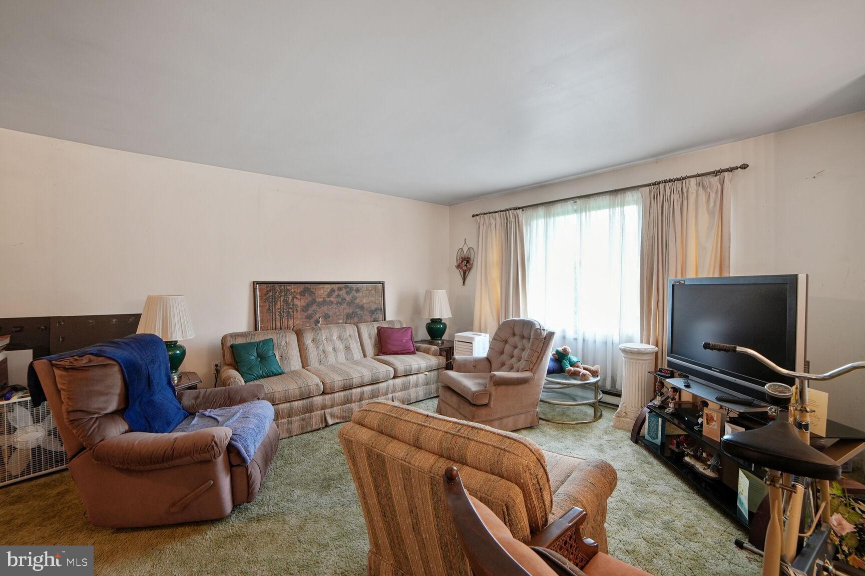3263 Hawks Hill Road New Windsor, MD 21776 - Photo 5 of 19 a living room with furniture and a flat screen tv
