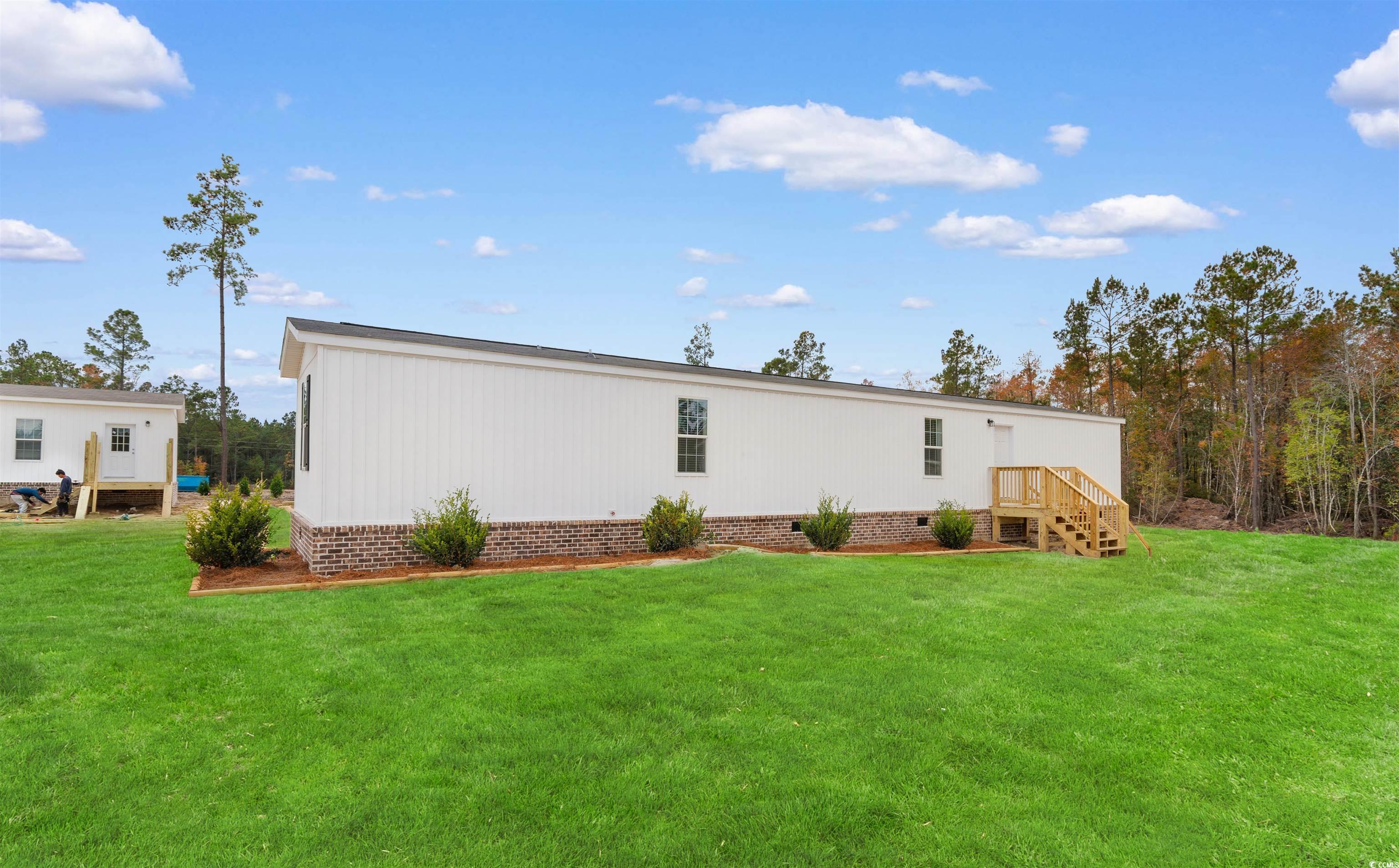 121 Feather Drive Georgetown, SC 29440 - Photo 28 of 40 Back of property with crawl space and a yard