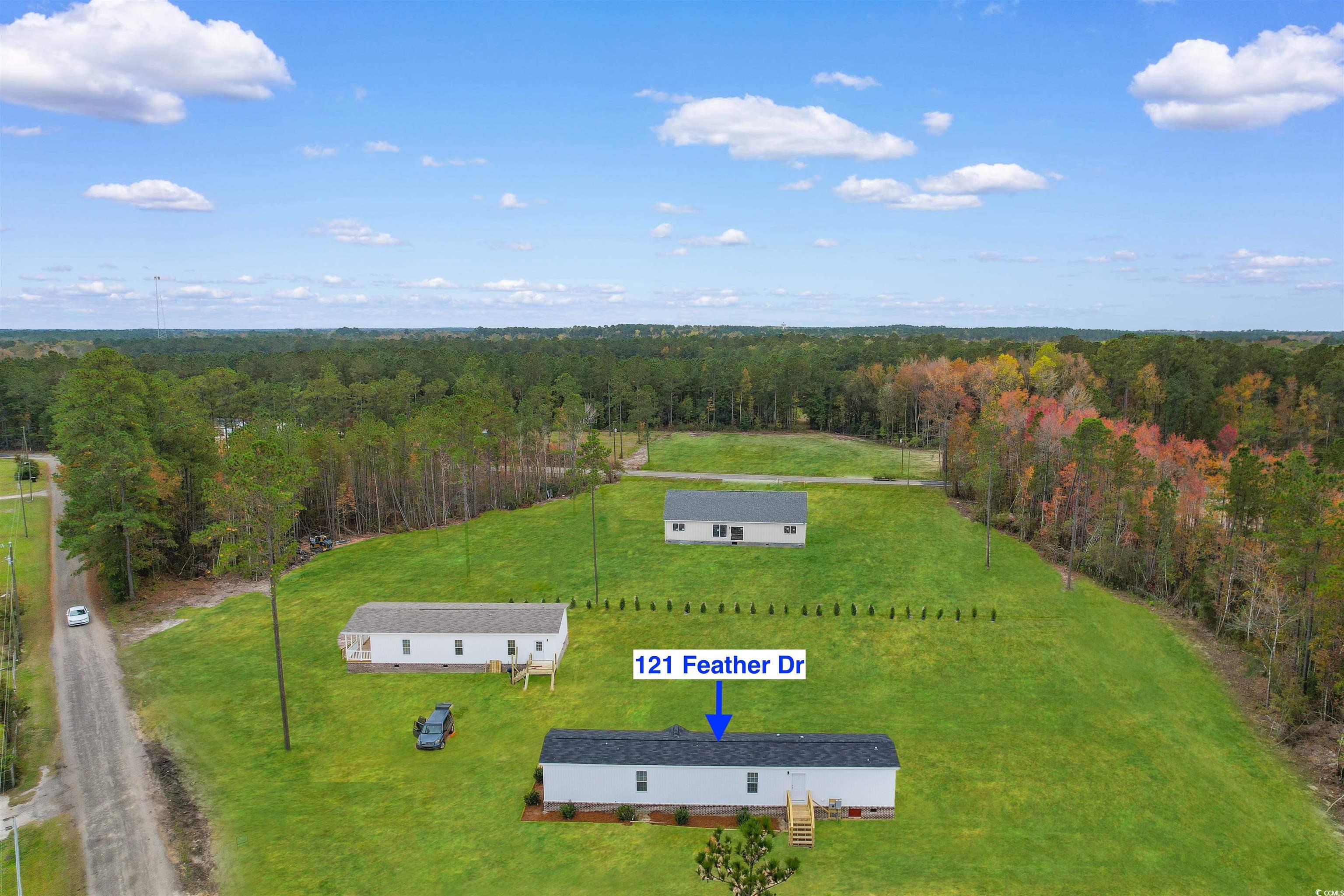 121 Feather Drive Georgetown, SC 29440 - Photo 30 of 40 View of subject property featuring a heavily wooded area