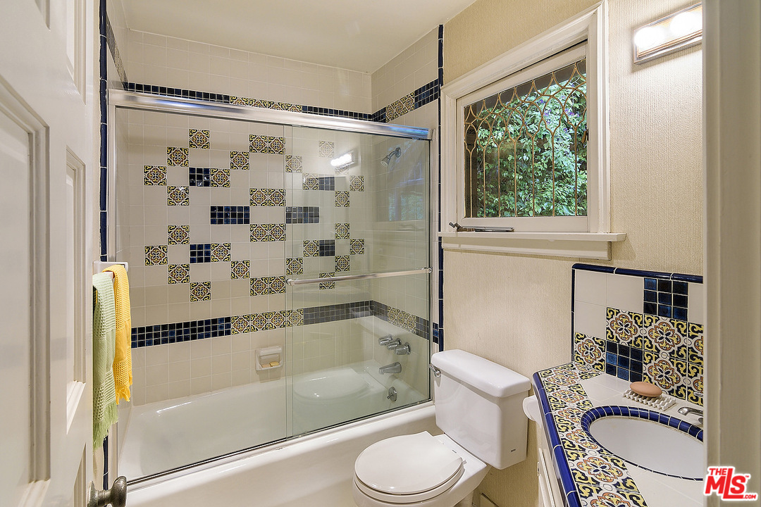 37 Haldeman Road Santa Monica, CA 90402 - Photo 13 of 23 a bathroom with a granite countertop bathtub sink vanity mirror and toilet
