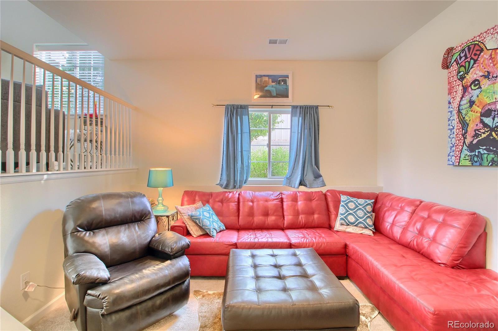 1335 South Chambers Road, Unit 101 Aurora, CO 80017 - Photo 13 of 40 a living room with furniture and a couch