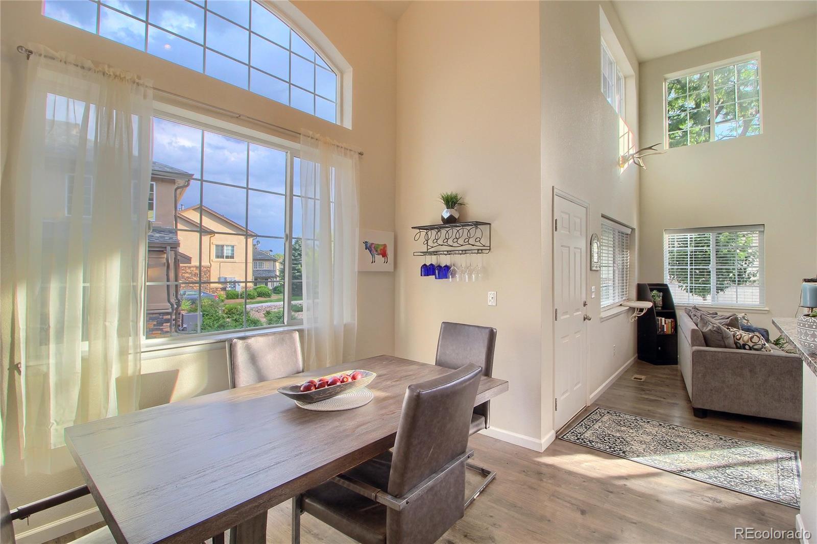 1335 South Chambers Road, Unit 101 Aurora, CO 80017 - Photo 19 of 40 a view of a dining room with furniture window and outside view