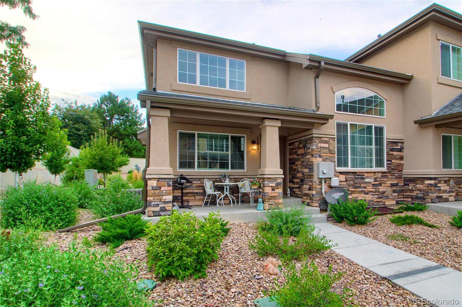 1335 South Chambers Road, Unit 101 Aurora, CO 80017 - Photo 3 of 40 a house view with a garden space