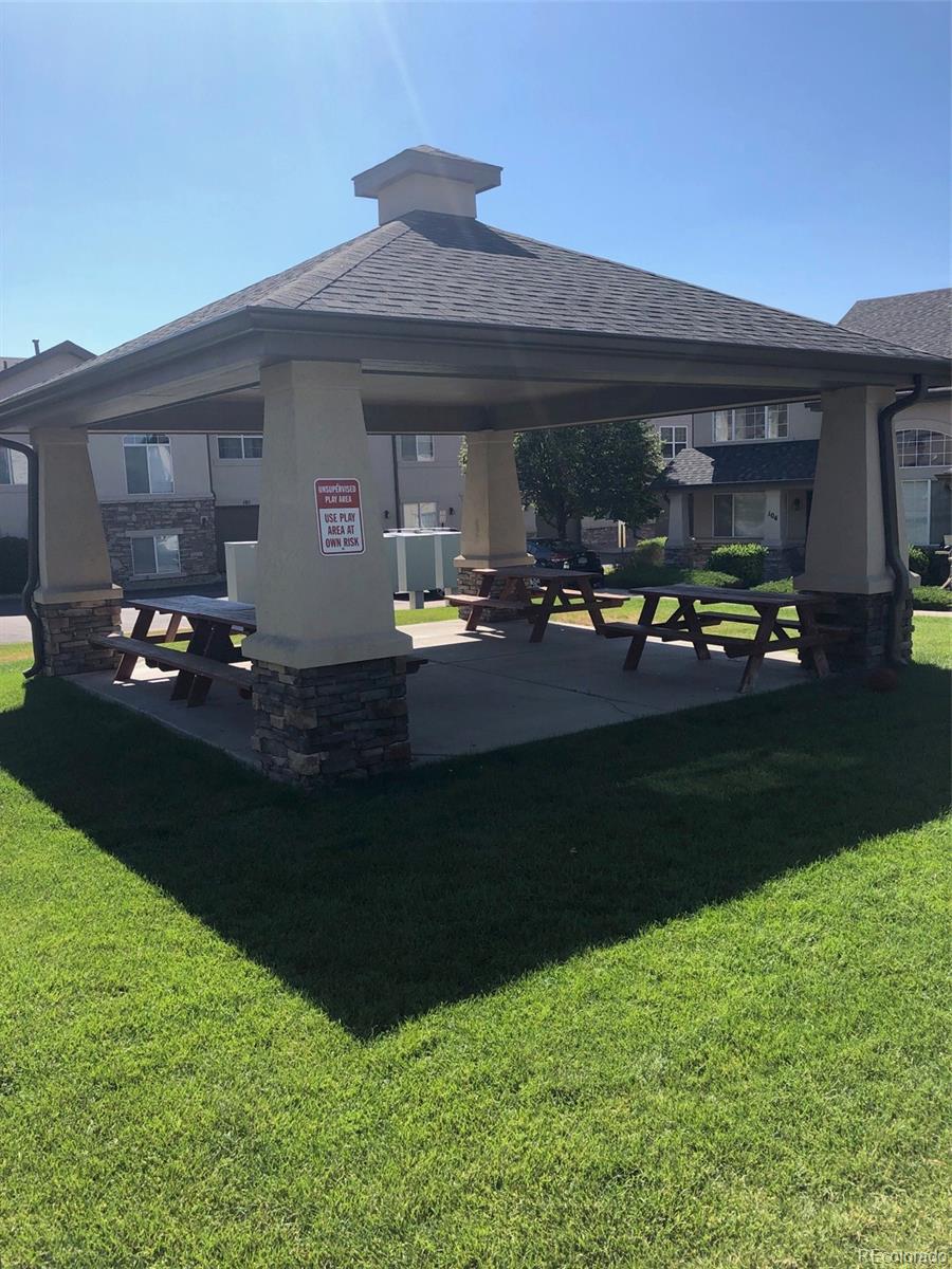 1335 South Chambers Road, Unit 101 Aurora, CO 80017 - Photo 38 of 40 a front view of a house with patio