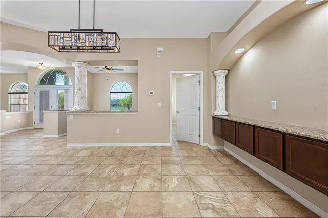 a view of a hallway with chandelier