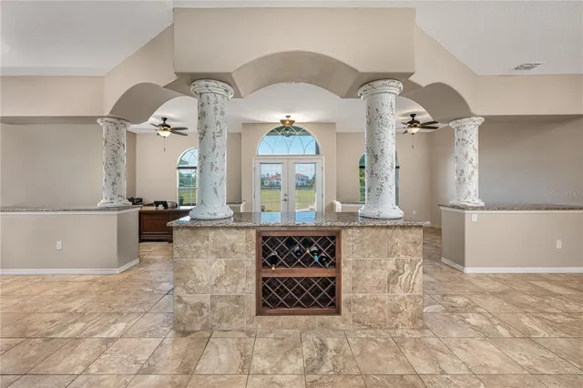 a view of living room with a chandelier and fireplace