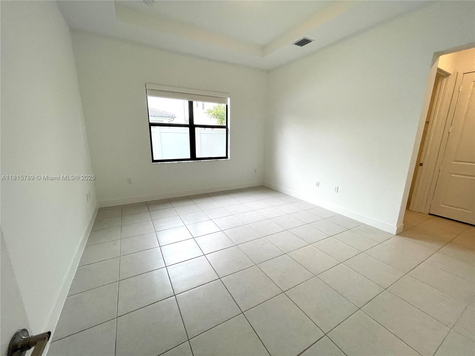4506 Southwest 174th Avenue, Unit 4506 Miramar, FL 33029 - Photo 25 of 80 a view of an empty room with a window