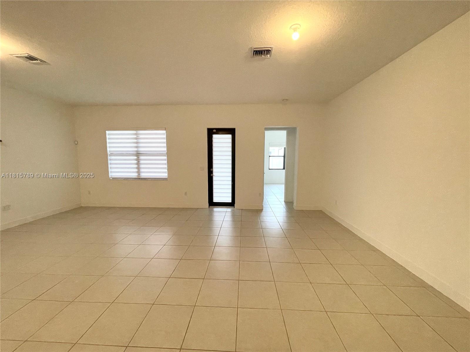 4506 Southwest 174th Avenue, Unit 4506 Miramar, FL 33029 - Photo 26 of 80 a view of an empty room with a window