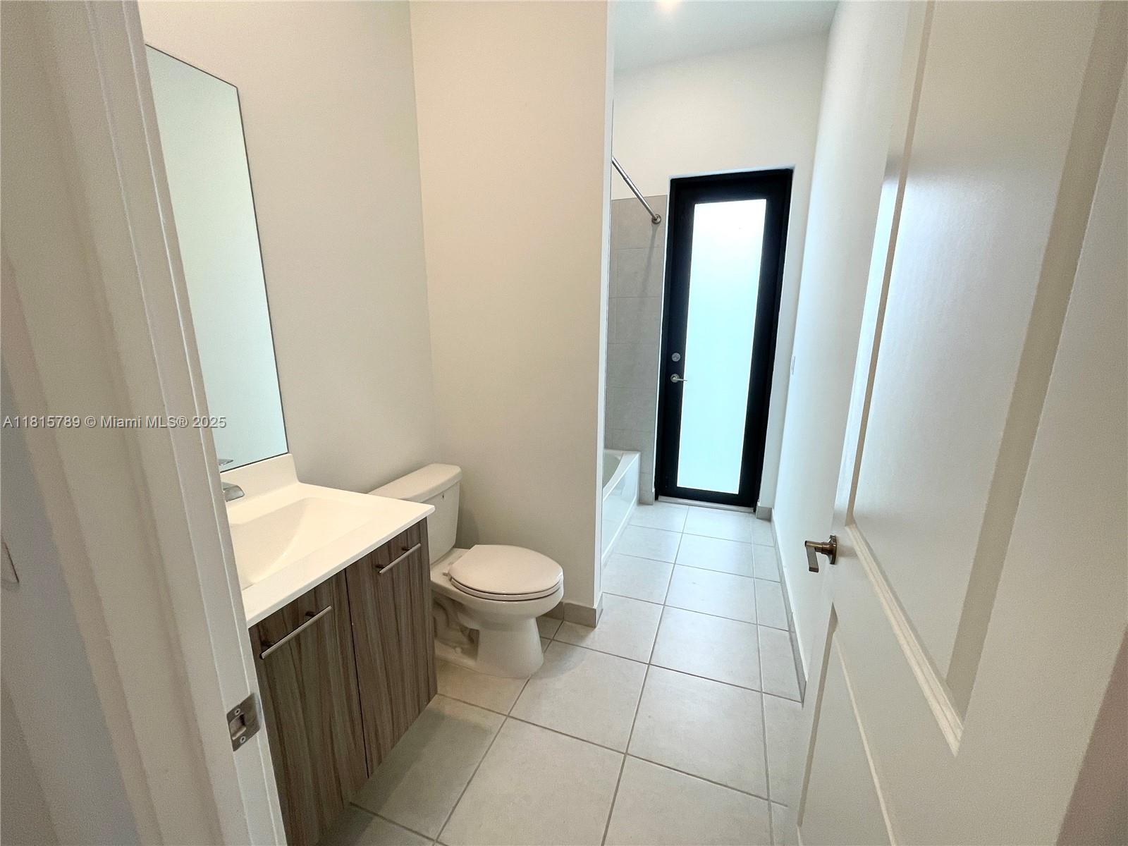 4506 Southwest 174th Avenue, Unit 4506 Miramar, FL 33029 - Photo 28 of 80 a bathroom with a toilet and a sink