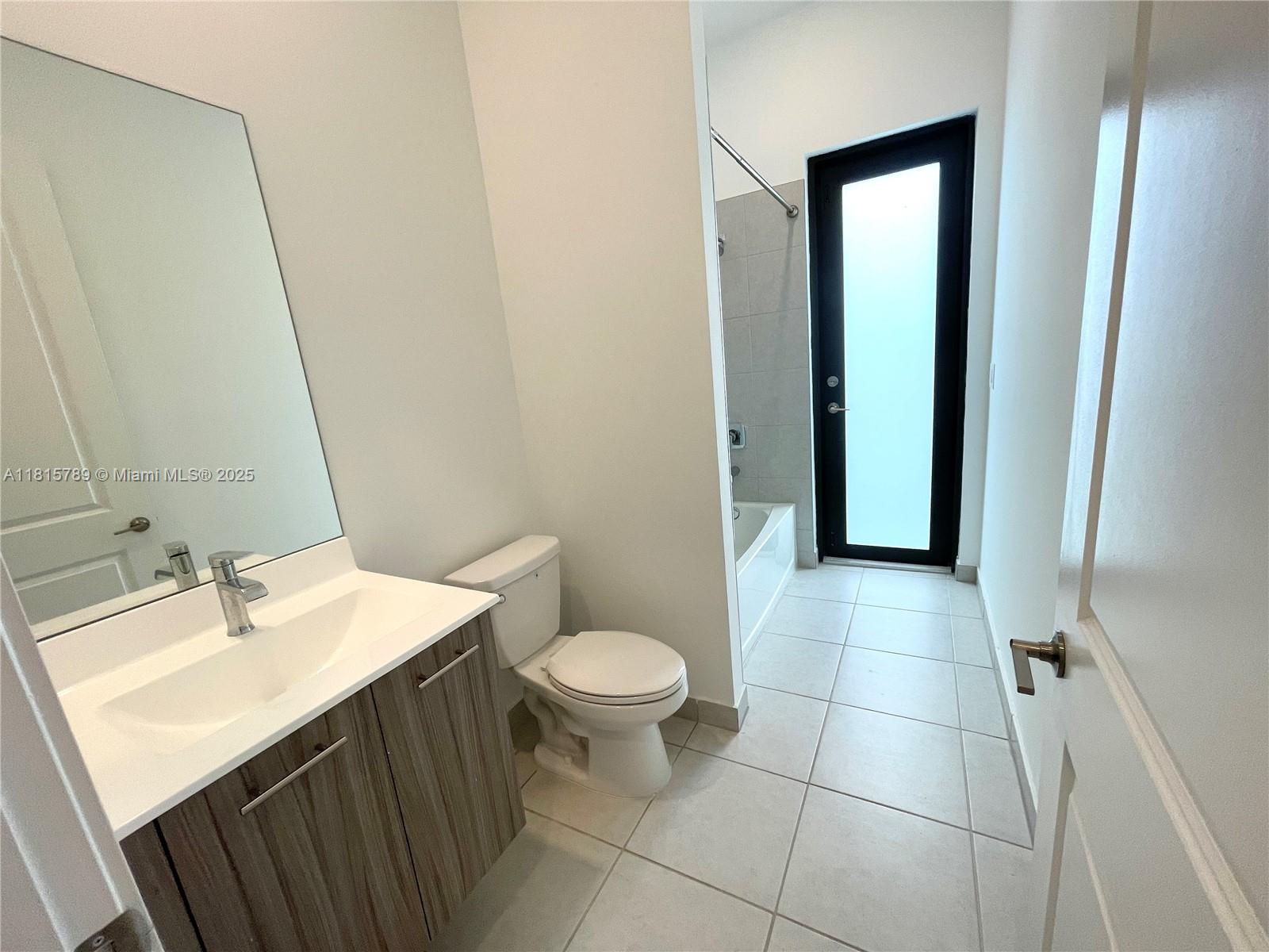 4506 Southwest 174th Avenue, Unit 4506 Miramar, FL 33029 - Photo 29 of 80 a bathroom with a sink a toilet and shower