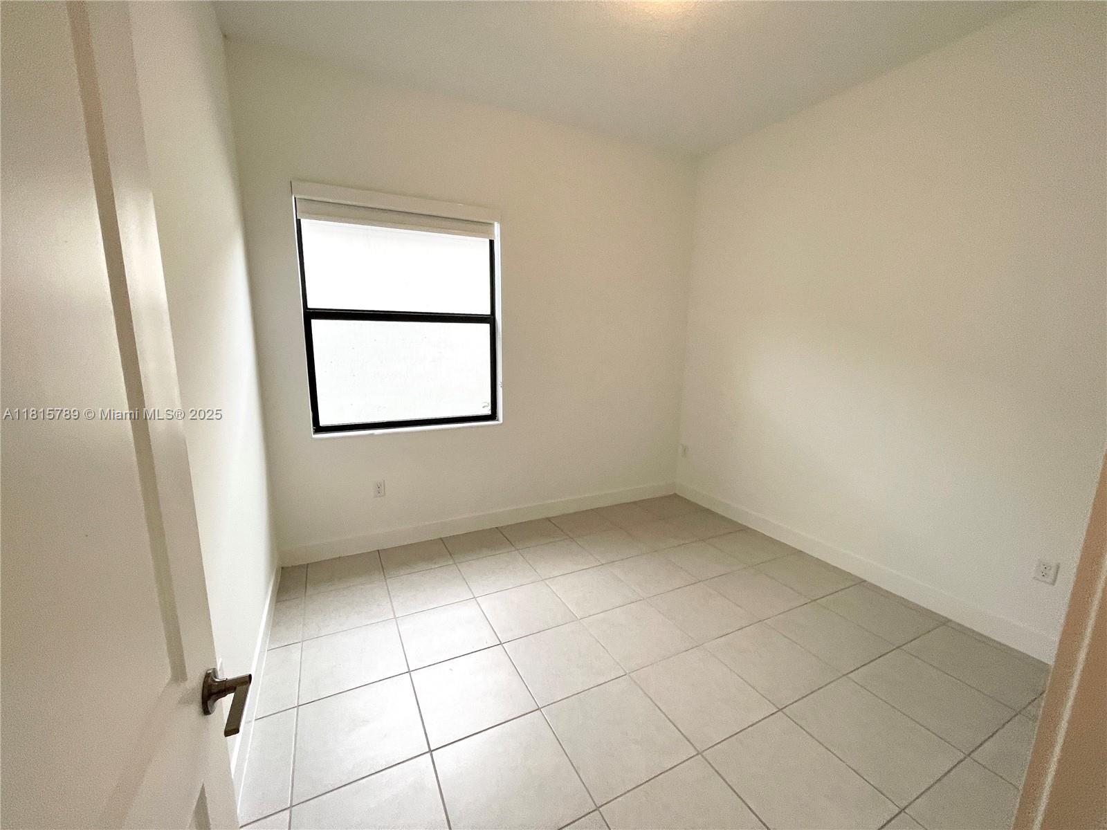 4506 Southwest 174th Avenue, Unit 4506 Miramar, FL 33029 - Photo 33 of 80 an empty room with a window