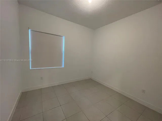 a kitchen with stainless steel appliances a refrigerator sink and microwave