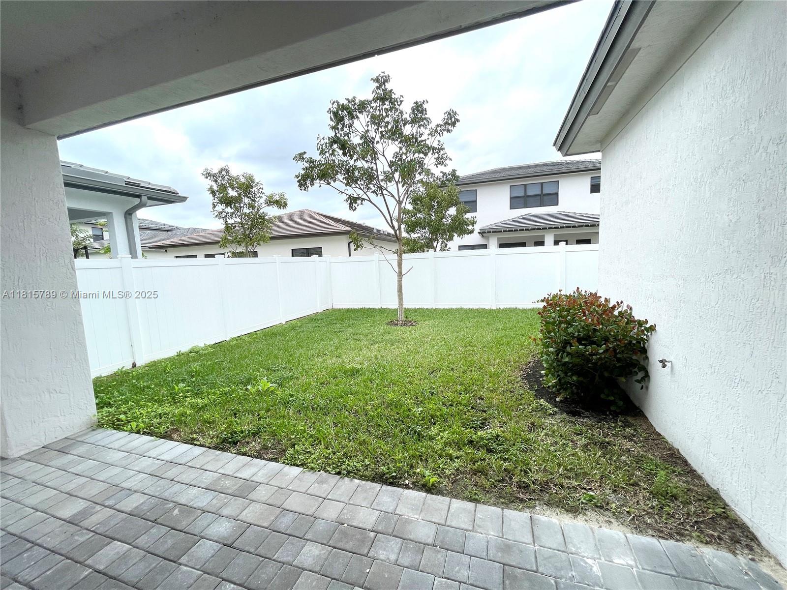 4506 Southwest 174th Avenue, Unit 4506 Miramar, FL 33029 - Photo 4 of 80 a backyard of a house with lots of green space