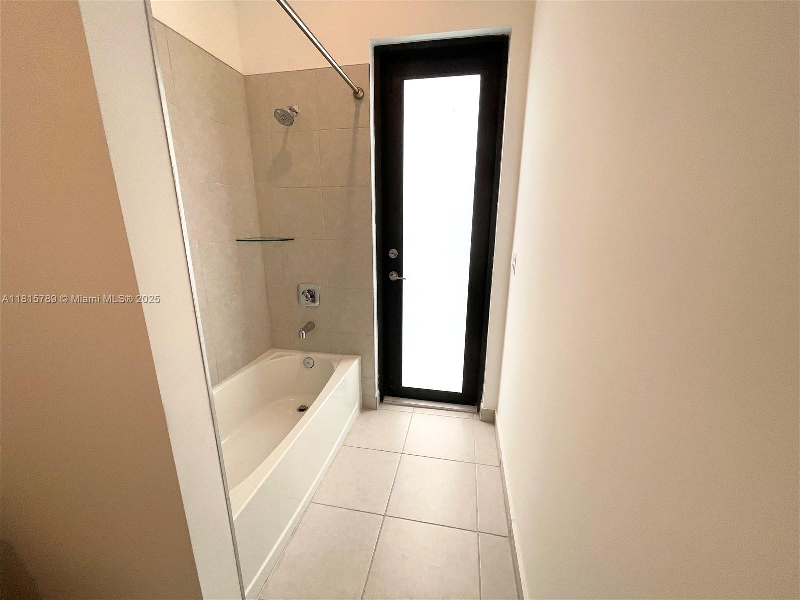 4506 Southwest 174th Avenue, Unit 4506 Miramar, FL 33029 - Photo 65 of 80 a bathroom with a tub shower and toilet