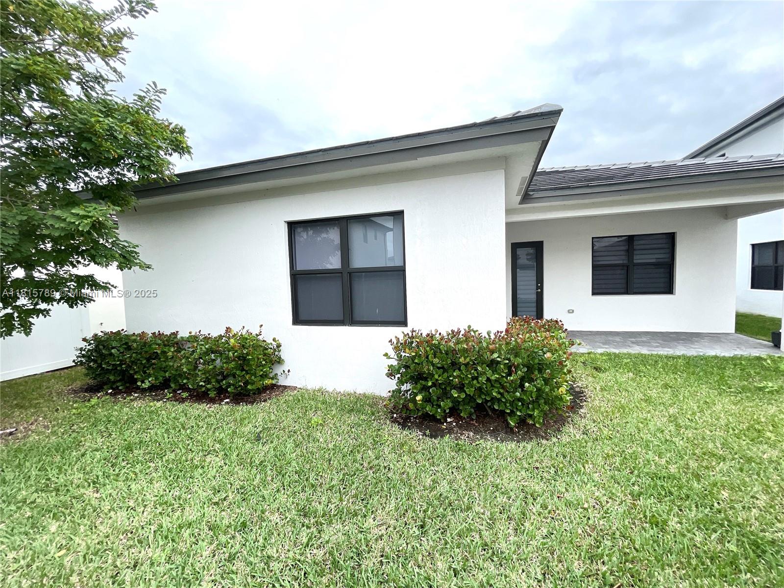 4506 Southwest 174th Avenue, Unit 4506 Miramar, FL 33029 - Photo 70 of 80 a front view of a house with garden