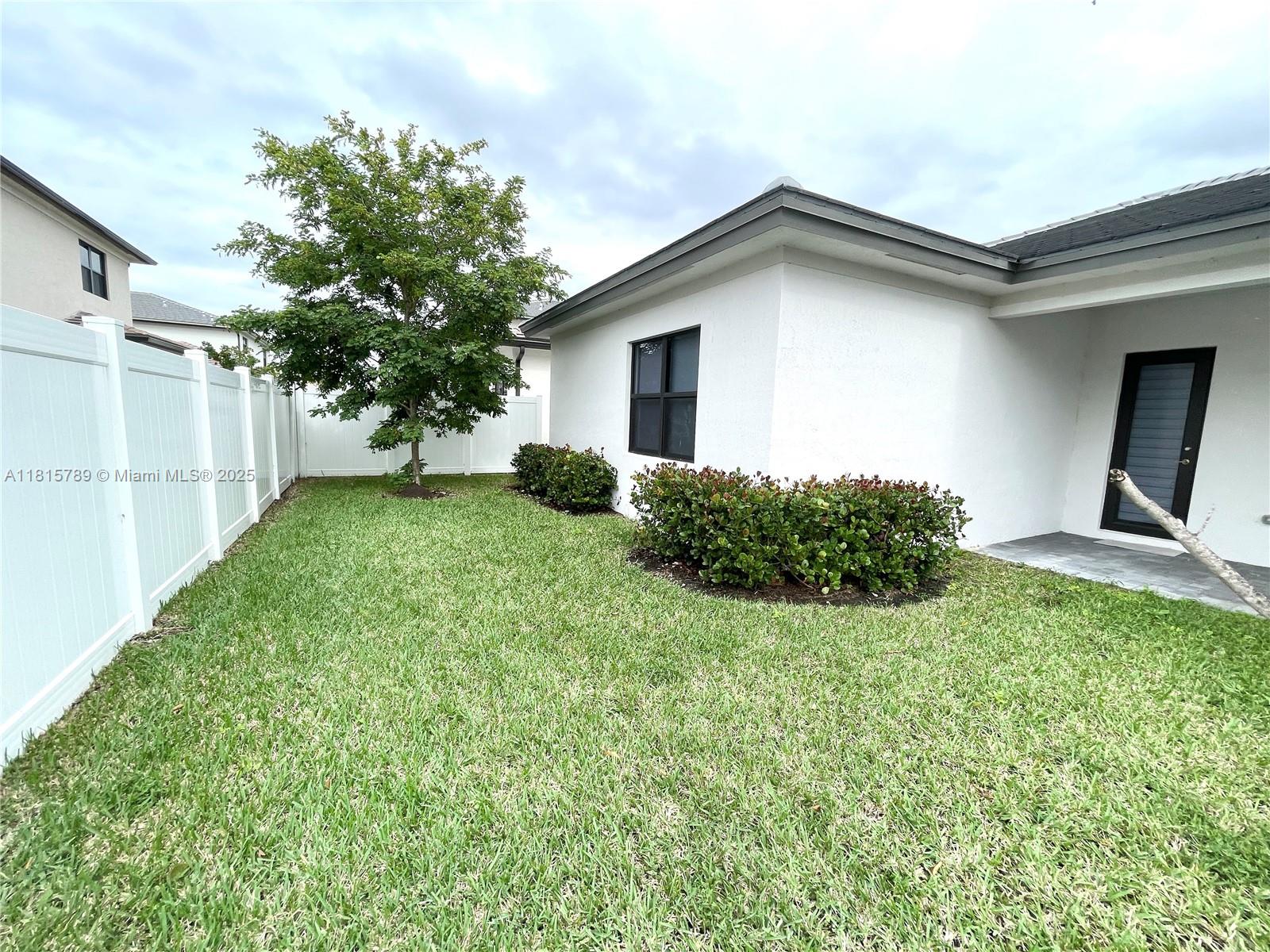 4506 Southwest 174th Avenue, Unit 4506 Miramar, FL 33029 - Photo 8 of 80 a view of backyard with a garden and plants