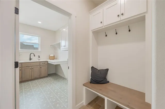 a kitchen with a sink and cabinets
