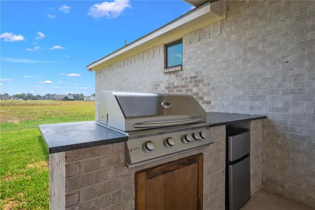 a stove top oven sitting inside of a kitchen